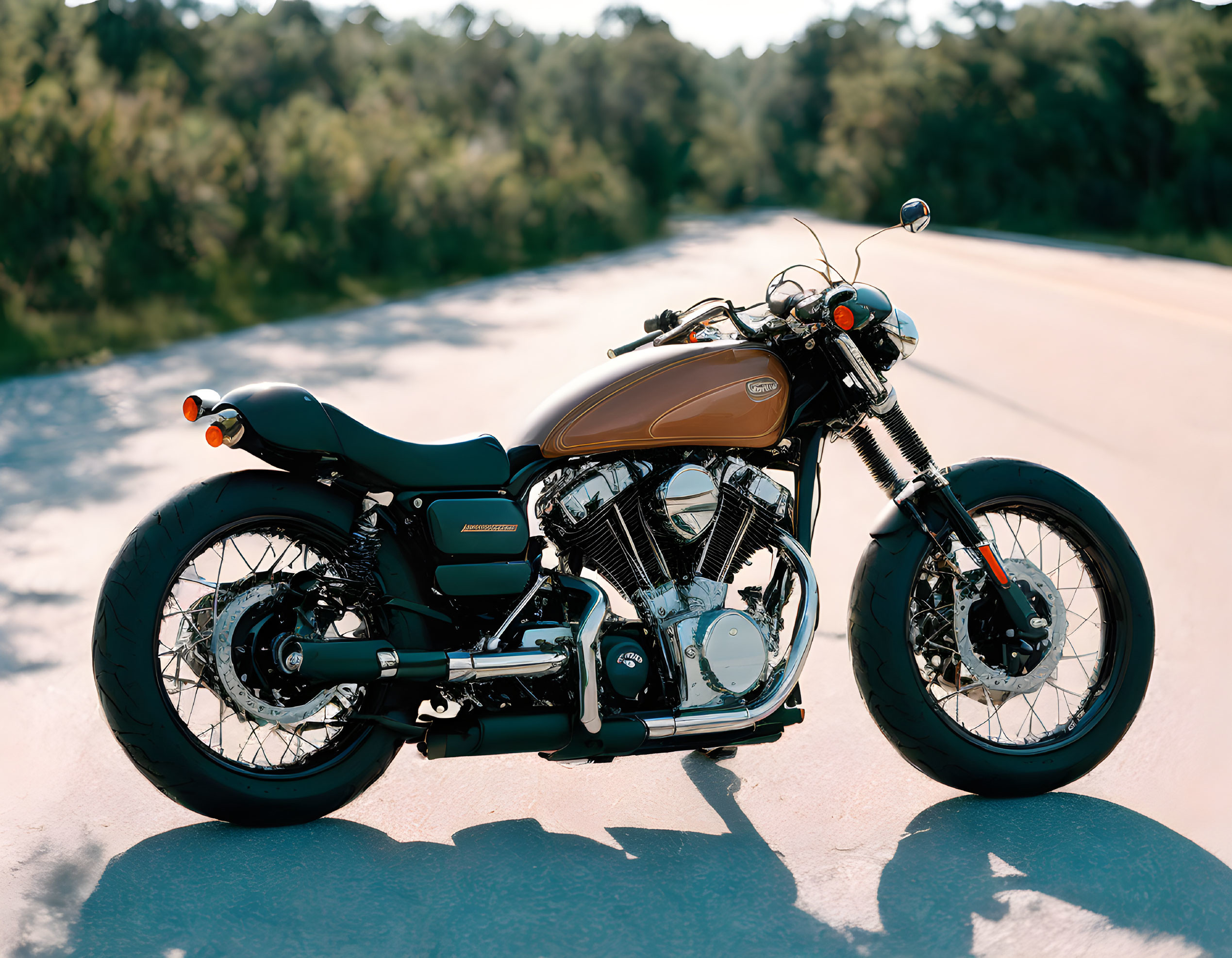 Vintage Motorcycle with Brown Tank and Black Seat on Asphalt Road