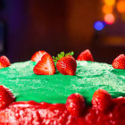 Vibrant green frosted cake with strawberries and sugar in warm-lit room