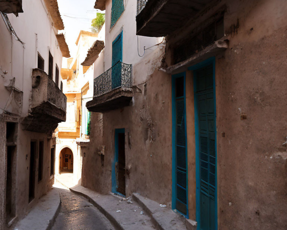 Traditional Old Town Alley with Earthy Walls and Blue Doors