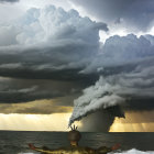 Person with outstretched arms against stormy ocean backdrop