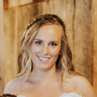 Woman with Coral-like Embellishments and Jeweled Headpiece on Textured Background