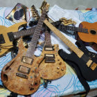 Assorted Guitars and Banjo in Different Designs on Blue Background