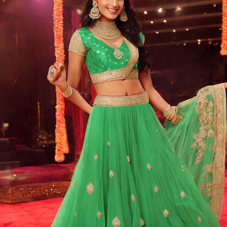 Woman in Green Embellished Lehenga with Gold Jewelry Pose