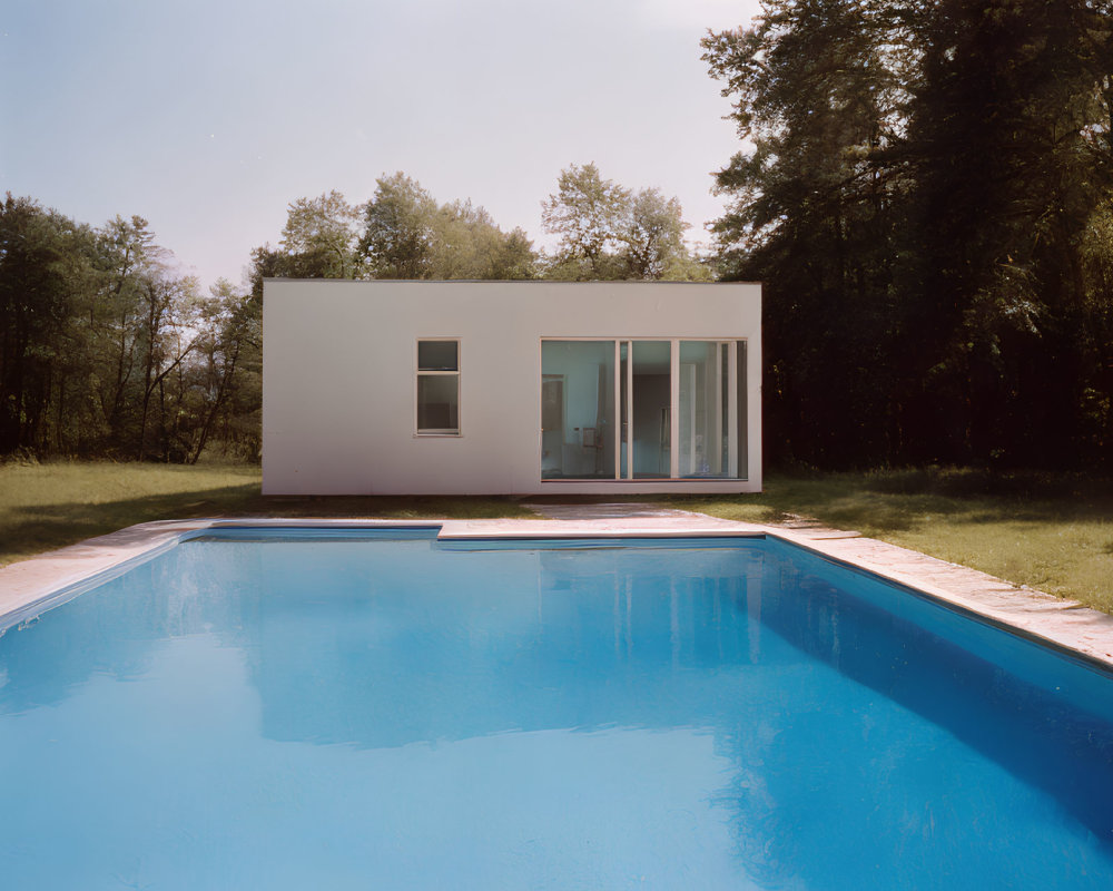 Contemporary White House with Large Windows and Outdoor Pool