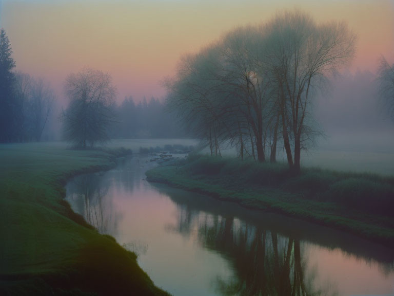 Misty dawn landscape with river, trees, and pastel sky