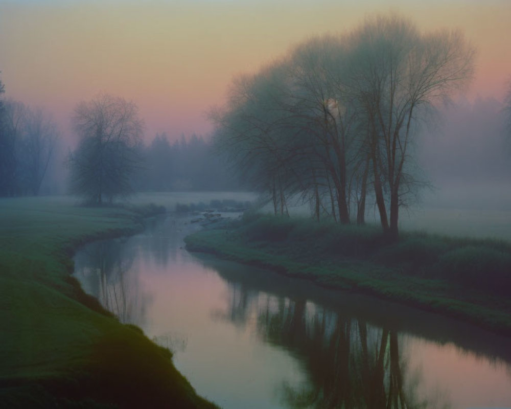 Misty dawn landscape with river, trees, and pastel sky