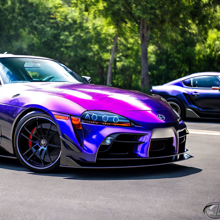 Purple Sports Car with Black Rims and Custom Front Bumper Parked on Asphalt