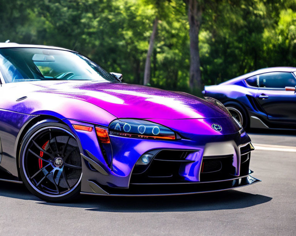 Purple Sports Car with Black Rims and Custom Front Bumper Parked on Asphalt