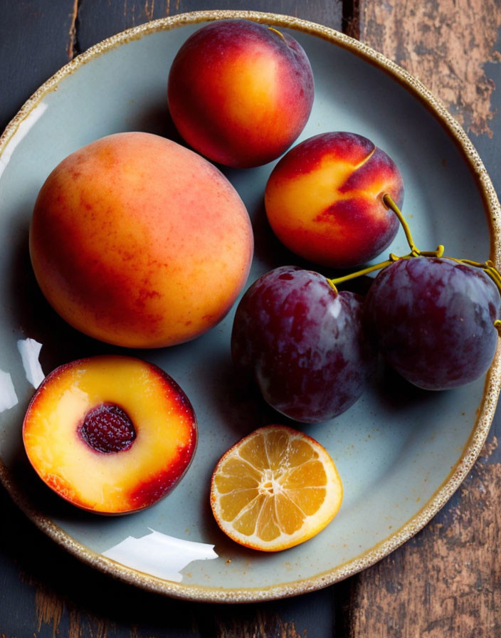 Plate of Fresh Fruits: Peaches, Nectarines, Plums, and Sliced Kum