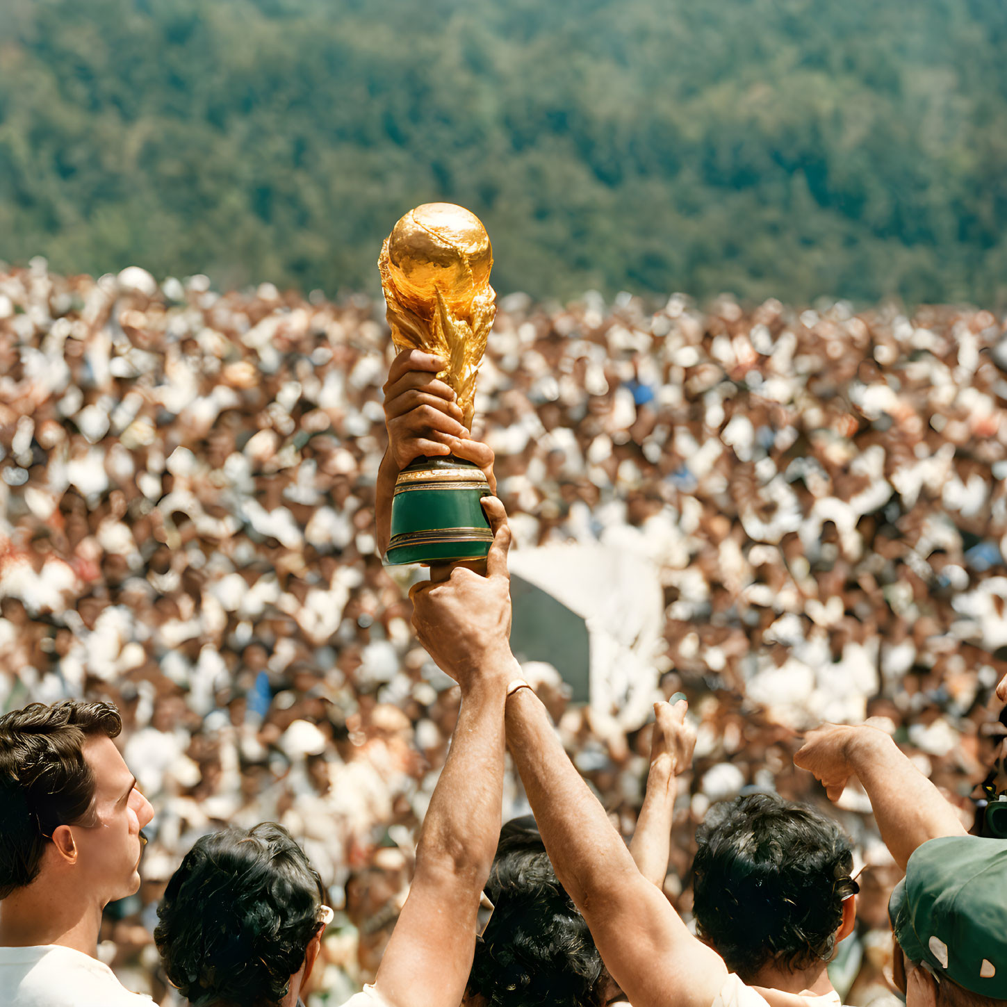 Crowd cheers as person holds FIFA World Cup trophy