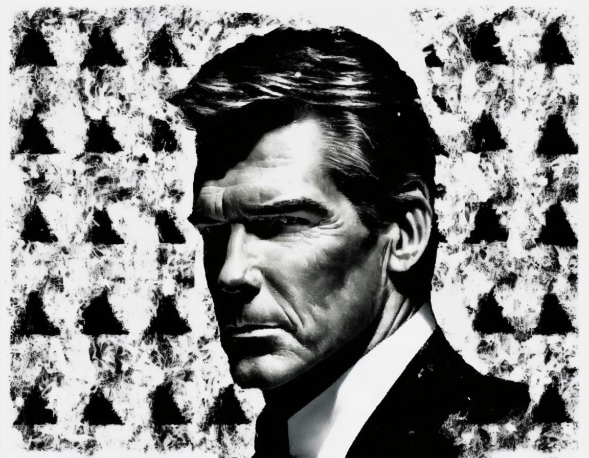 Monochrome portrait of a man in suit and tie against abstract backdrop