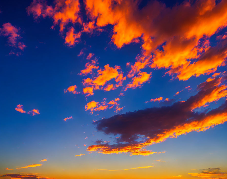 Fiery orange clouds in vibrant sunset