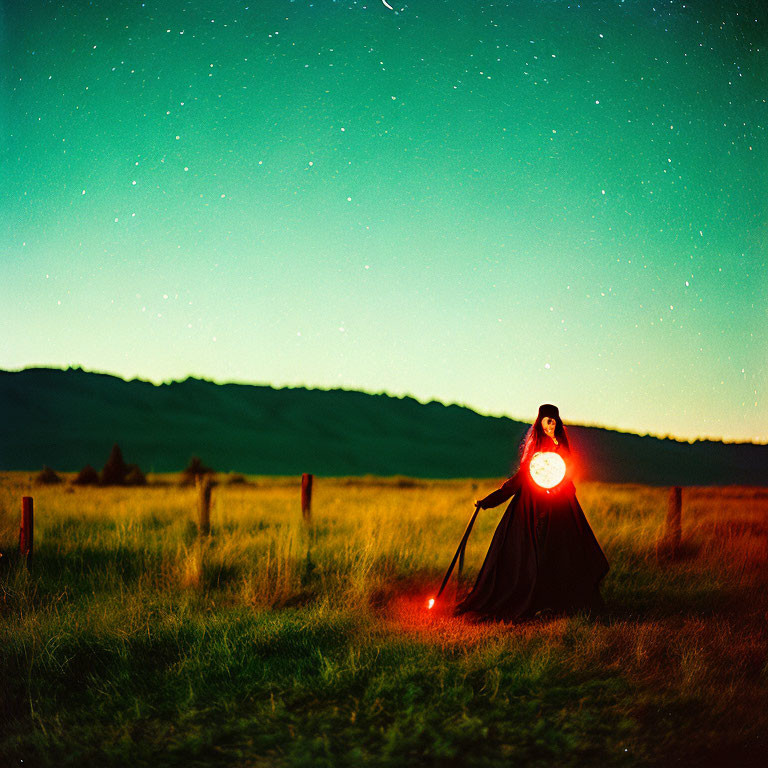 Mysterious figure with bright light in starry field at dusk