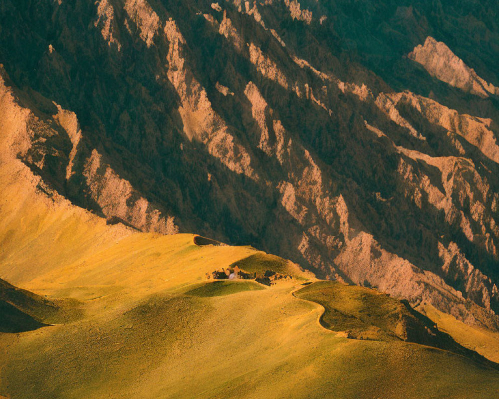 Sunlit hills and rugged mountains in serene landscape