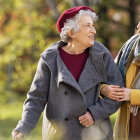 Vintage Clothing: Stylish Women Amid Green Leaves and Yellow Fruits