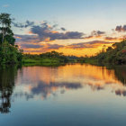 Colorful Mountain Silhouettes at Sunset Over Forest and Lake