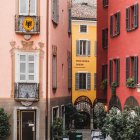 Colorful Pastel Buildings on Peaceful Street with Lush Greenery