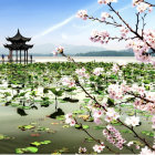 Whimsical landscape with pagoda, spherical trees, intricate plants, and blue river