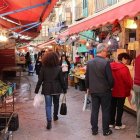 Vibrant traditional market scene with colorful stalls and cobbled streets