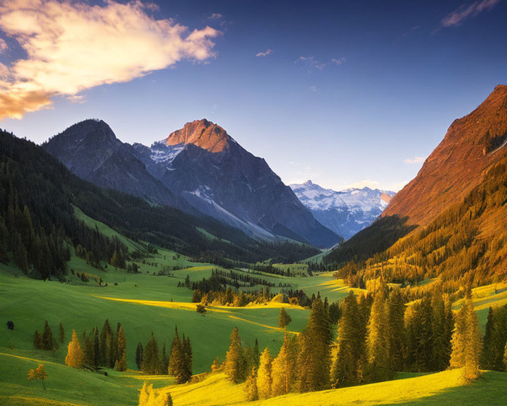 Scenic sunset valley with winding trail and mountains in golden light