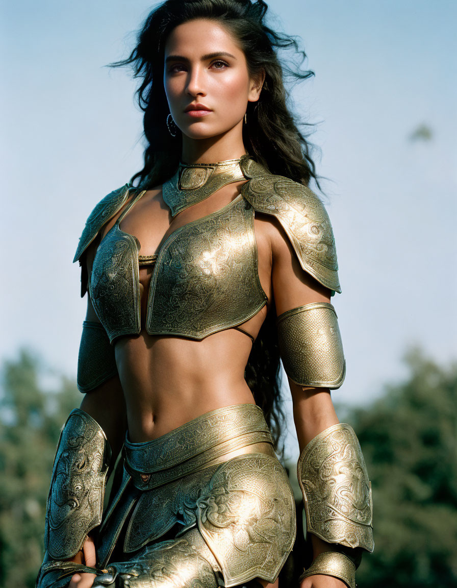 Golden armored woman poses confidently in natural setting with flowing hair