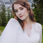 Elf woman portrait with sharp ears, elegant jewelry, forest and mountain backdrop