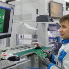 Futuristic woman in military uniform with robotic arms and digital portrait screen