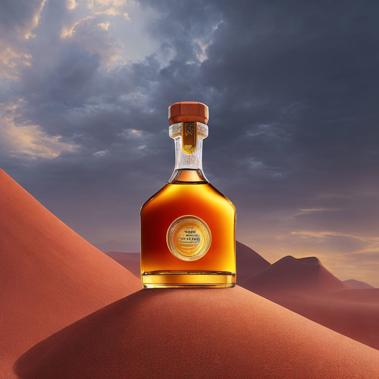 Amber-colored liquor bottle on sand dune with mountains and orange sky