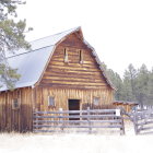 Snowy Landscape with Wooden Cabin and Frosted Trees