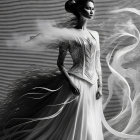 Woman in white dress with swirling fabric on dark background