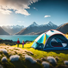 Couple near tent by serene mountain lake with snowy peaks