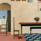 Room with chair, table, tiled floor, open archway to blue-domed buildings view