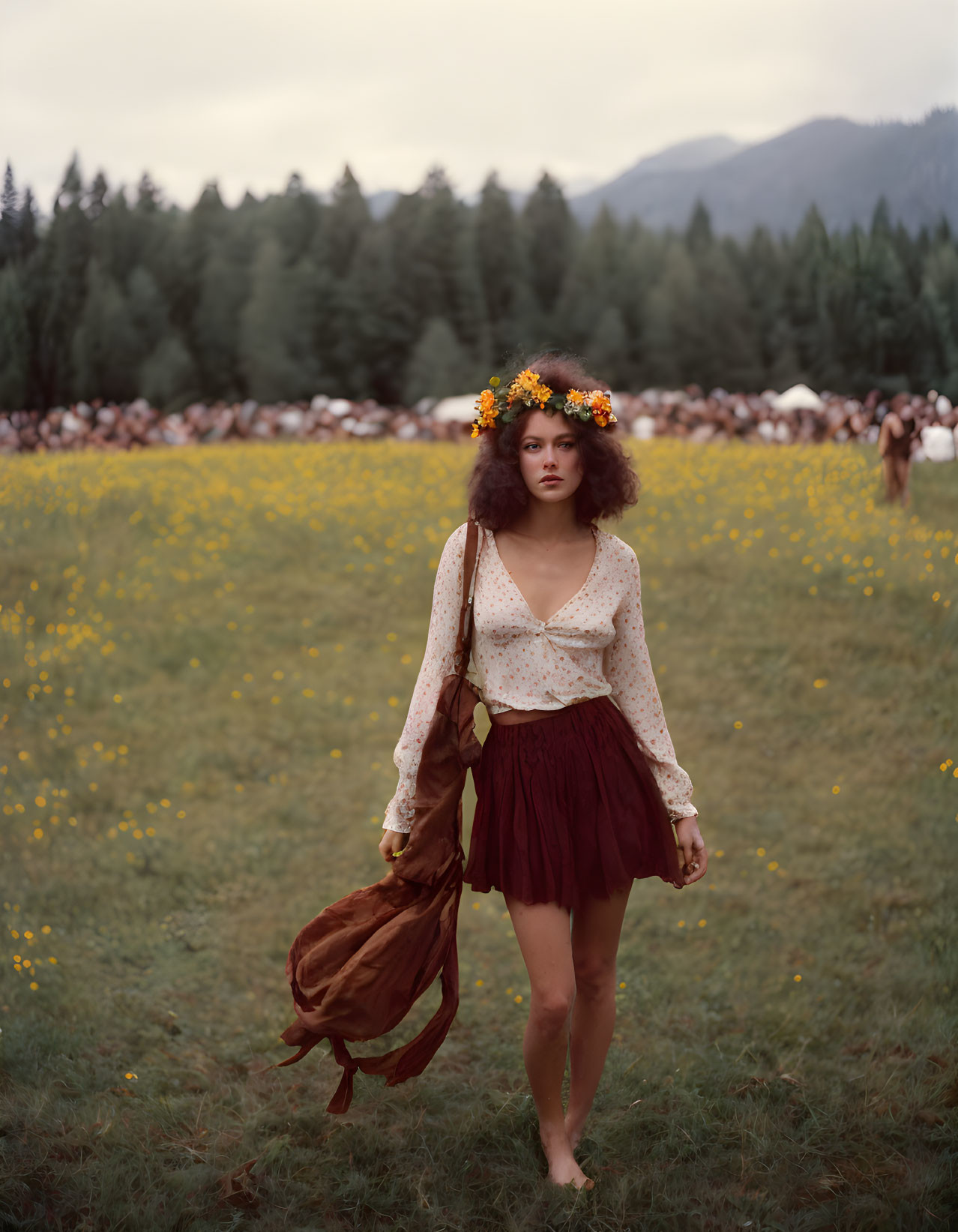 Woman in vintage clothing with floral crown in yellow flower field.