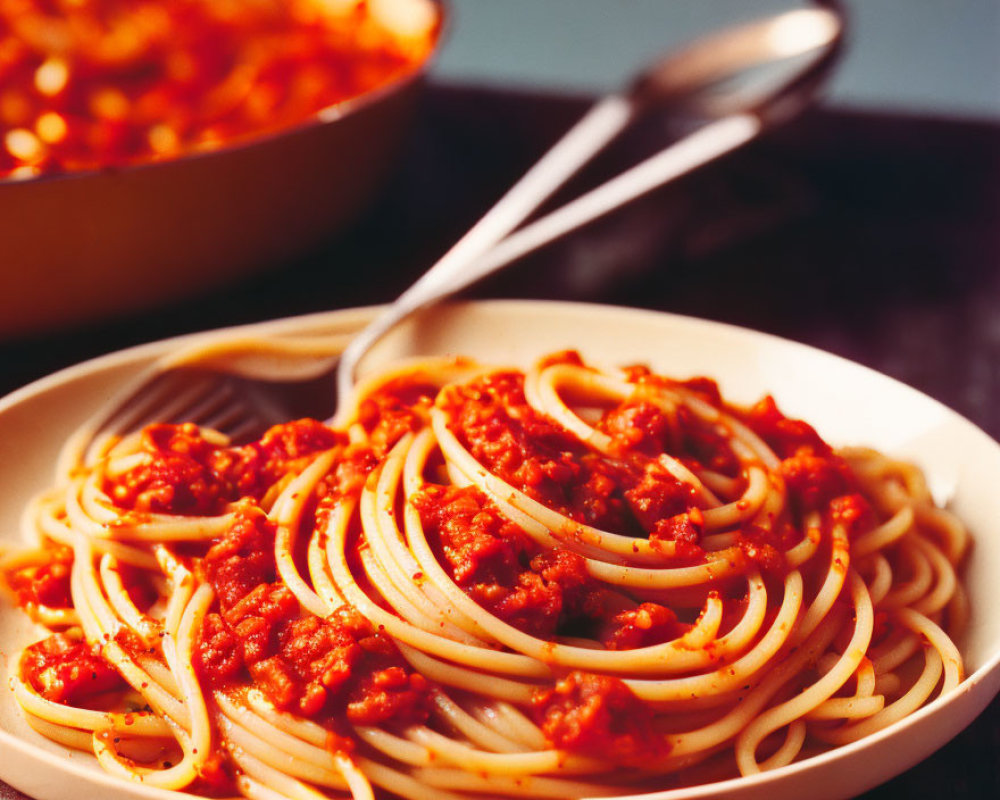 Plate of Spaghetti with Meaty Tomato Sauce and Spoon