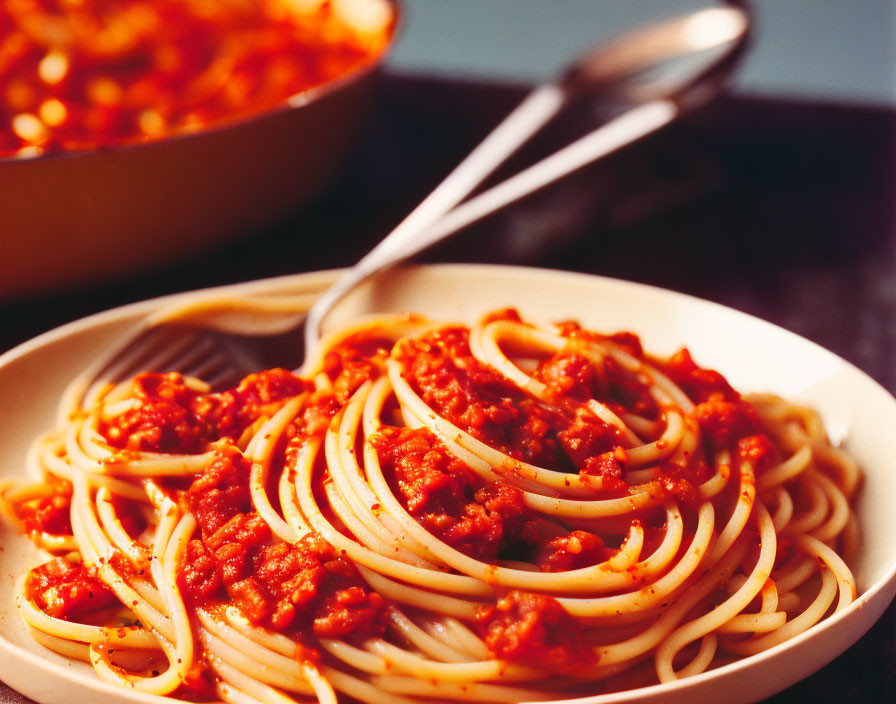 Plate of Spaghetti with Meaty Tomato Sauce and Spoon