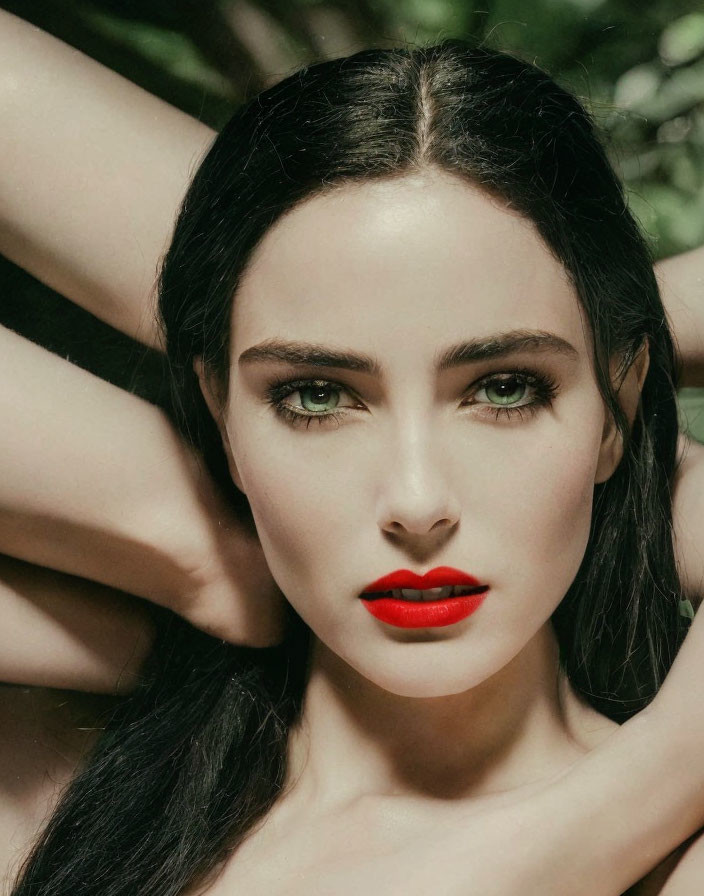 Close-up Portrait of Woman with Dark Hair and Striking Green Eyes