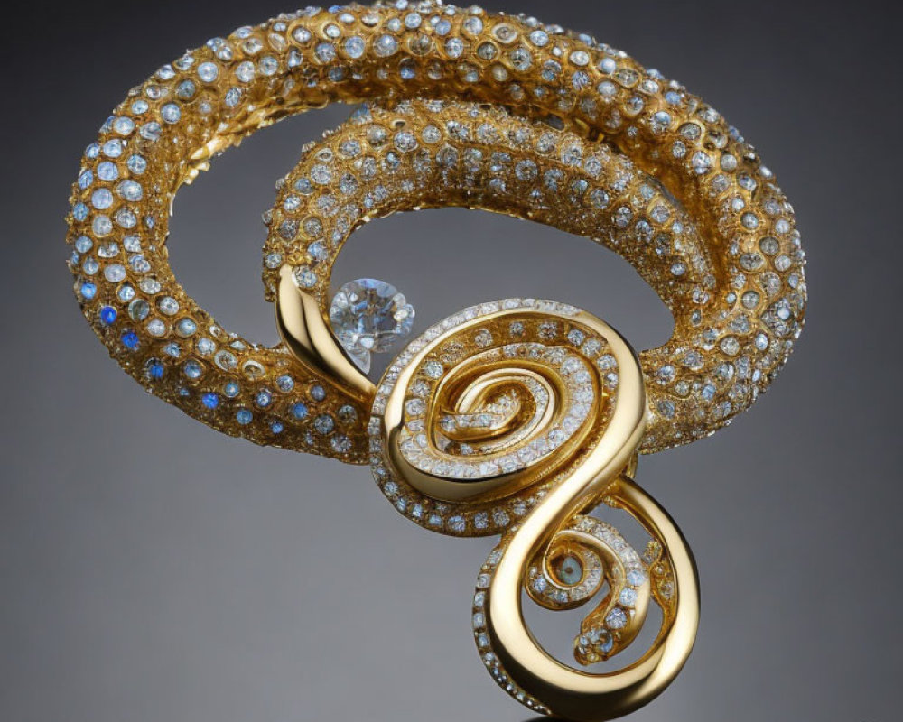 Spiral-shaped brooch with diamonds and center stone on reflective surface
