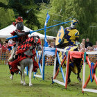 Armored knights on horseback charging through forest clearing