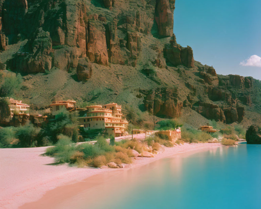 Pink Sand Beach with Turquoise Waters and Terracotta-Roofed Buildings