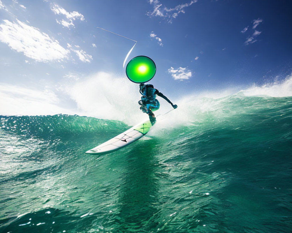 Kitesurfer catching air above large turquoise wave