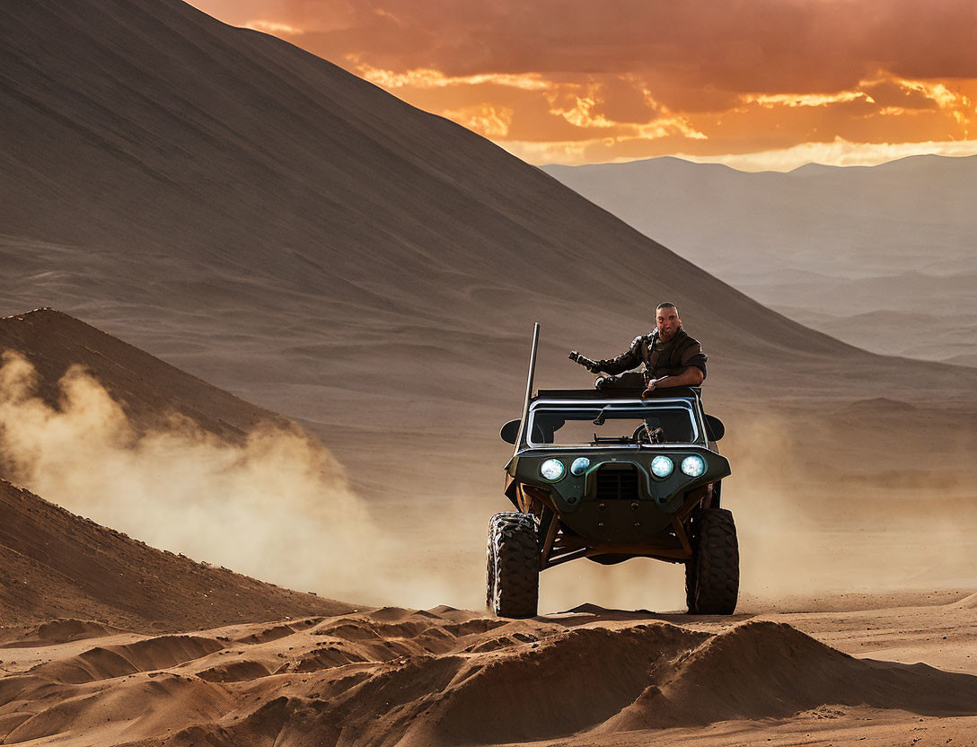 Person driving all-terrain vehicle on sandy dunes at sunset