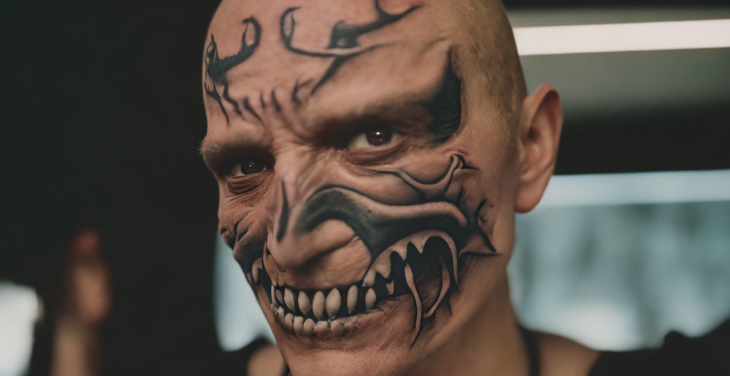 Intricate Black Facial Tattoo Mimicking Skeletal Features