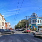 Devastated urban area with dilapidated buildings and abandoned car