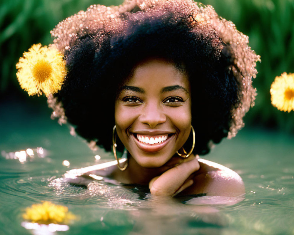 Smiling woman with hoop earrings in water surrounded by dandelions