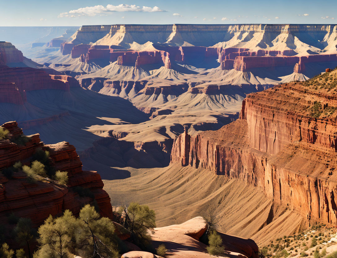 Majestic Grand Canyon red rock formations under clear blue sky