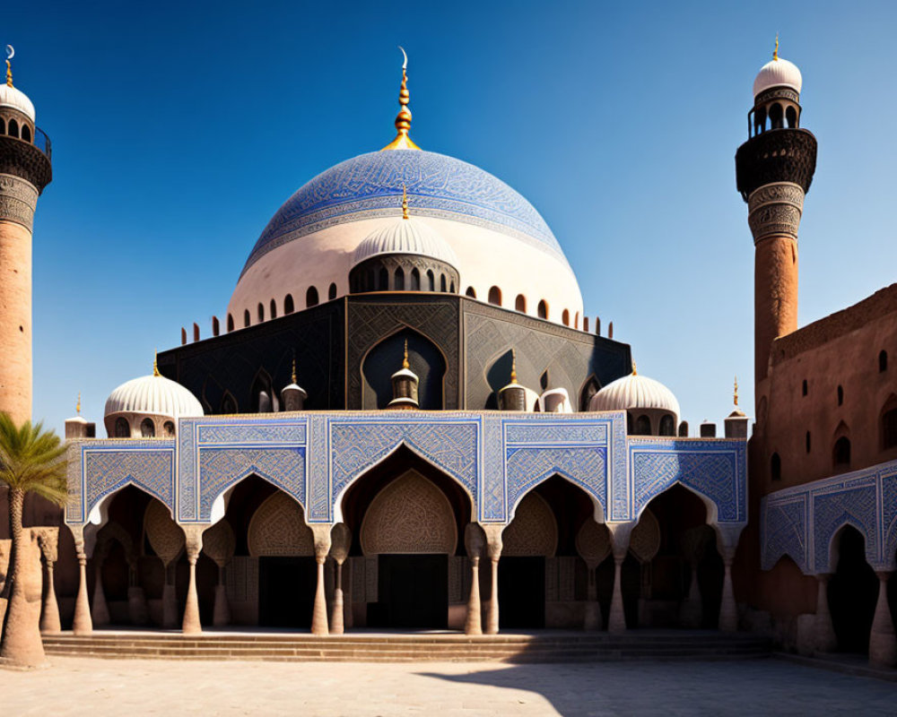 Blue-domed mosque with intricate patterns and minarets under clear sky