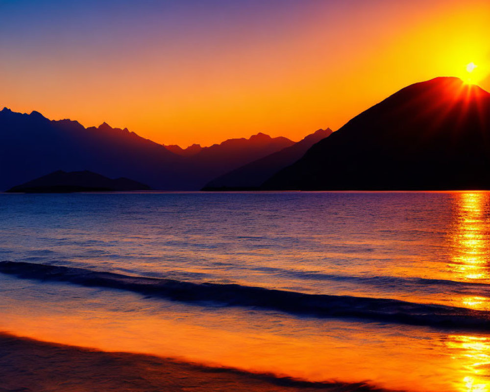 Tranquil lake at sunset with mountain silhouette reflected in serene landscape