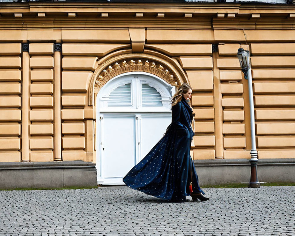 Woman in Blue Star-Patterned Dress Passing Historic Building