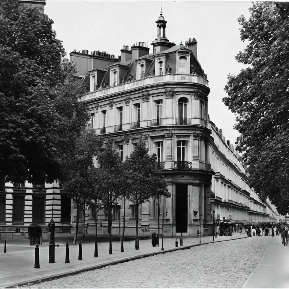 Monochrome street scene with corner building, pedestrians, and trees under cloudy sky