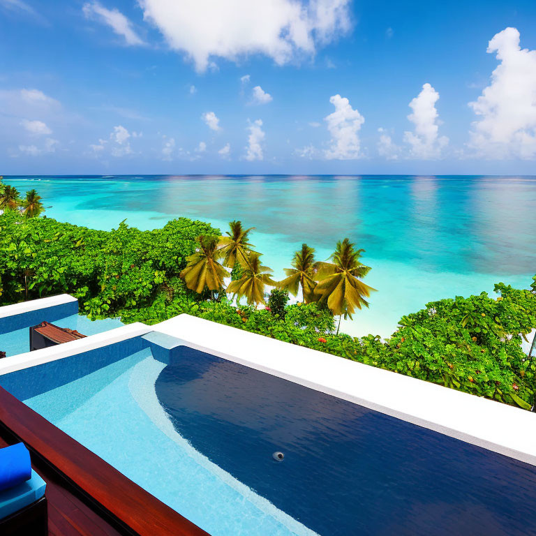 Infinity pool blending with tropical beach and clear blue sea under bright sky with palm trees.